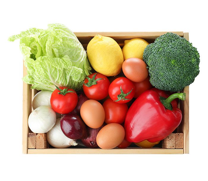 Produce fresh vegetables in a wooden box